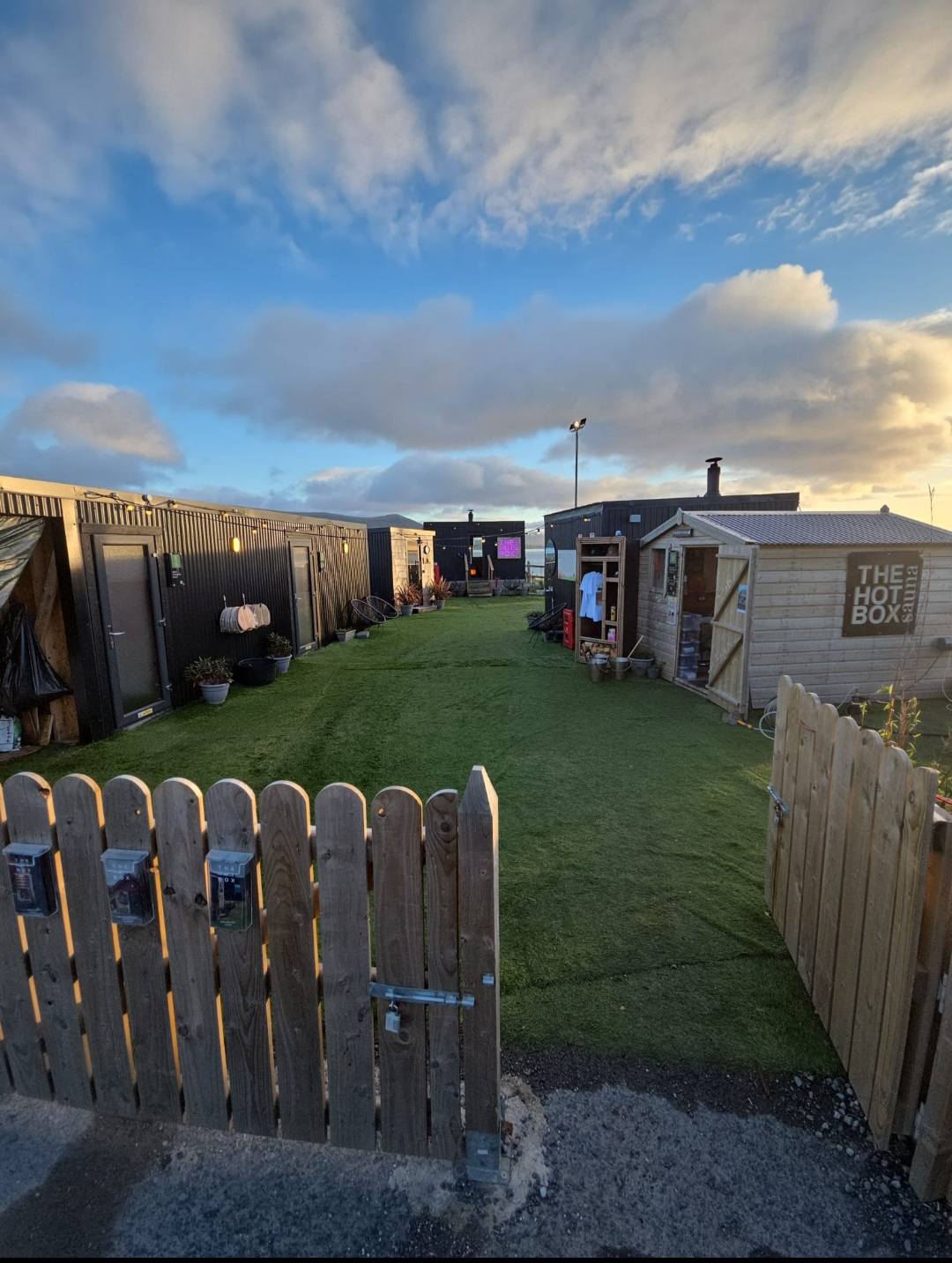 Composite deck with feature fence at dusk