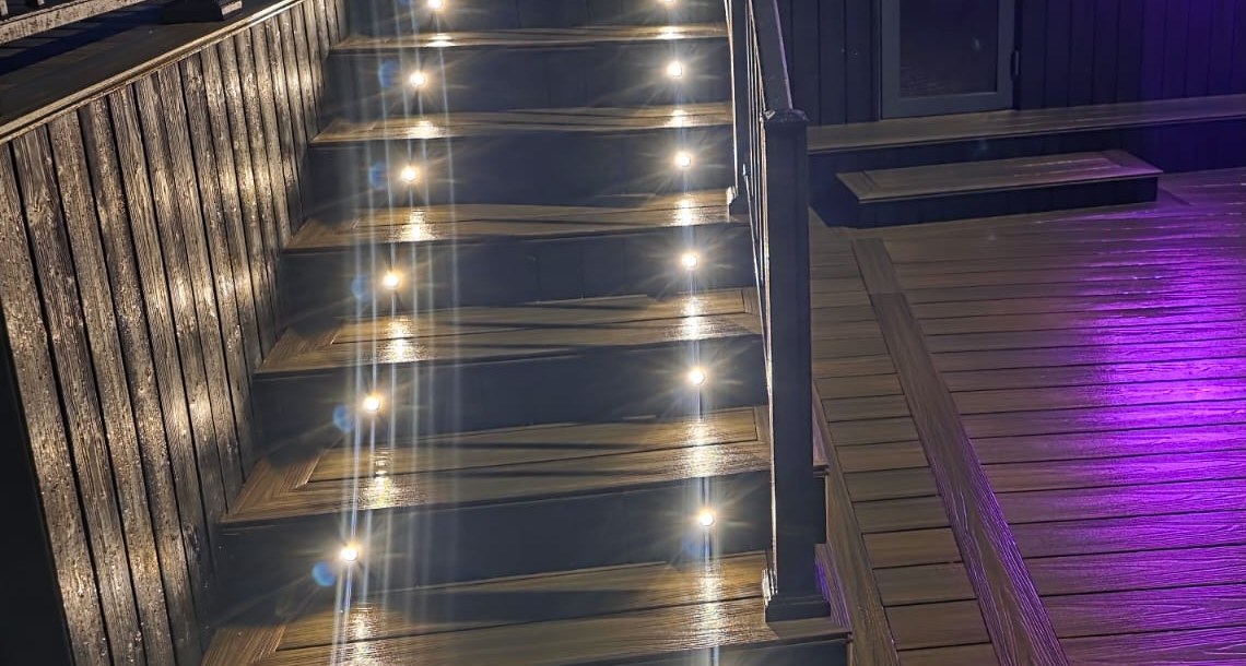 Intricate lit composite staircase with recessed tread lighting at Carlingford Marina