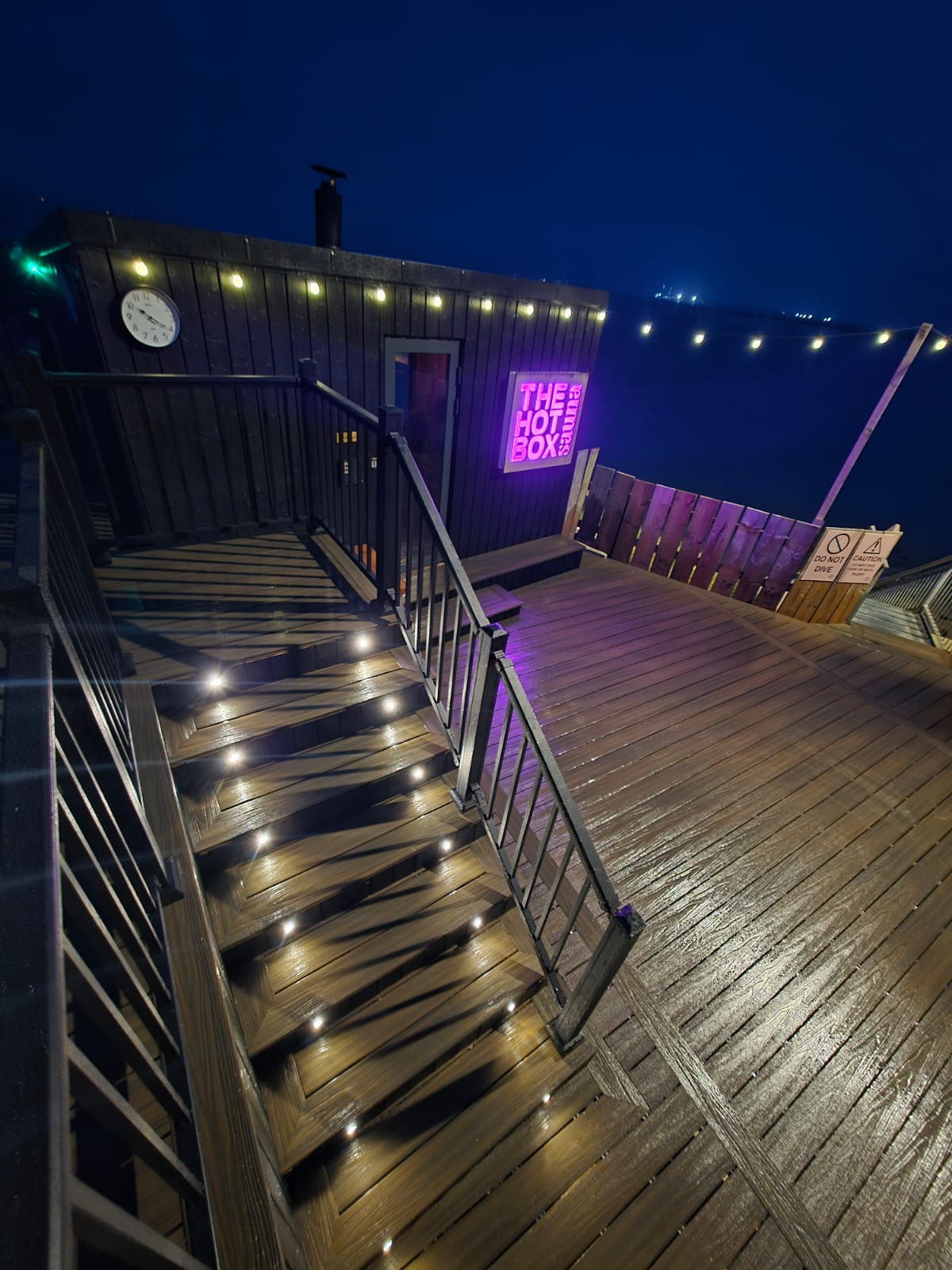 Lit deck stairs at night